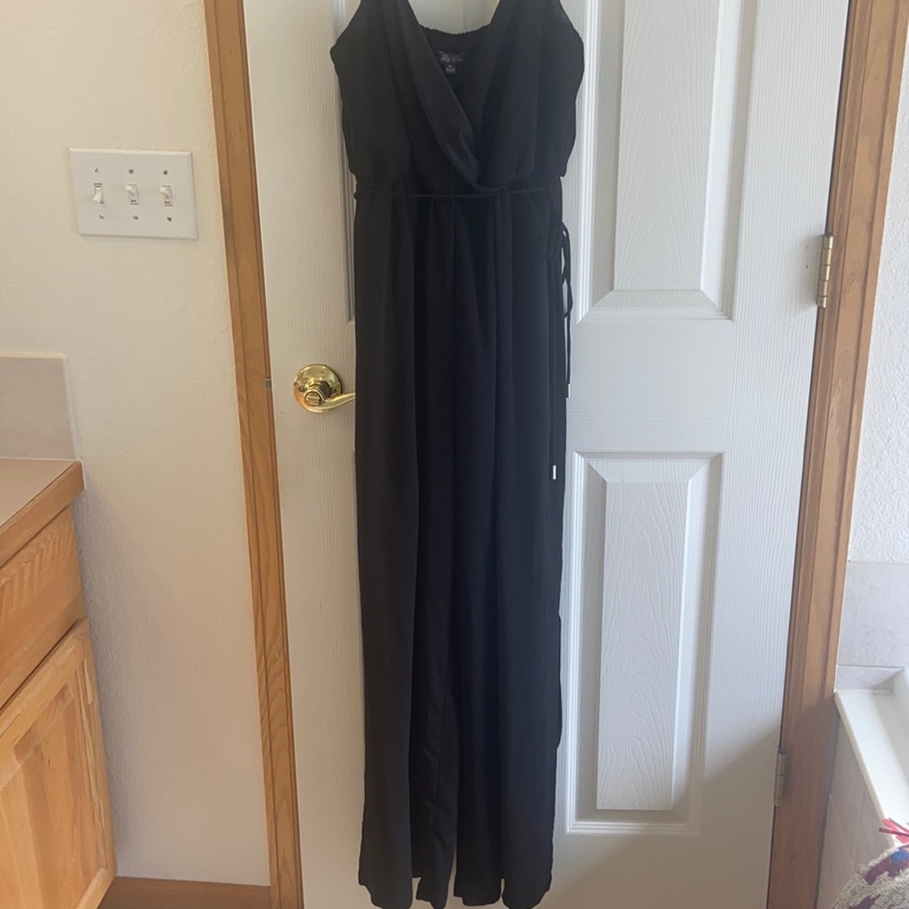 Black tank top jumper with slits up the legs.